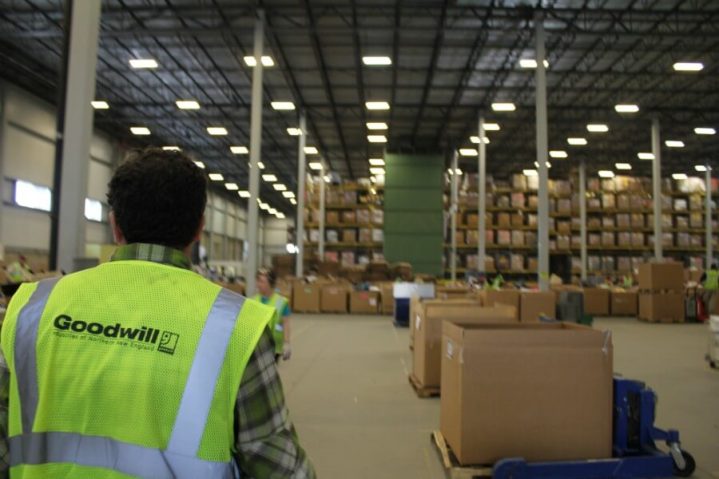 Man in a large warehouse filled with boxes