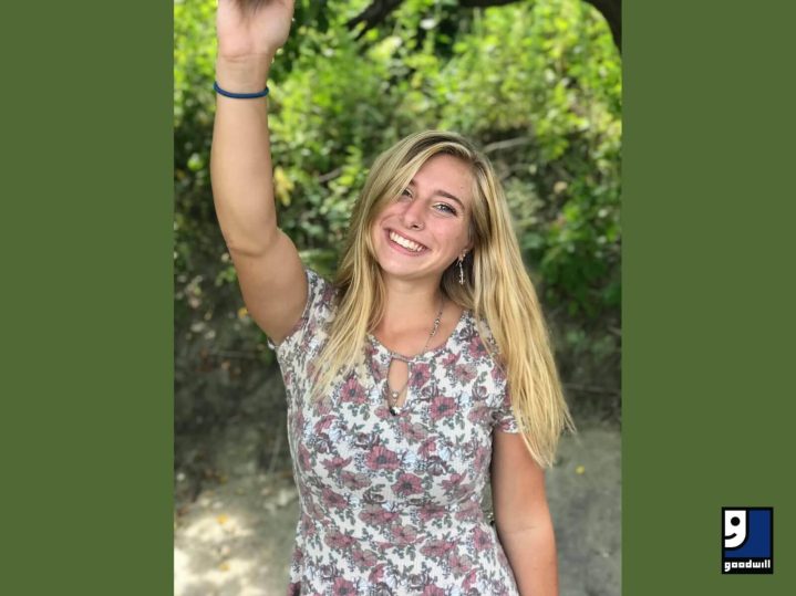 Vanessa, a blonde teenager, smiles at the camera after getting job help from Goodwill in Maine