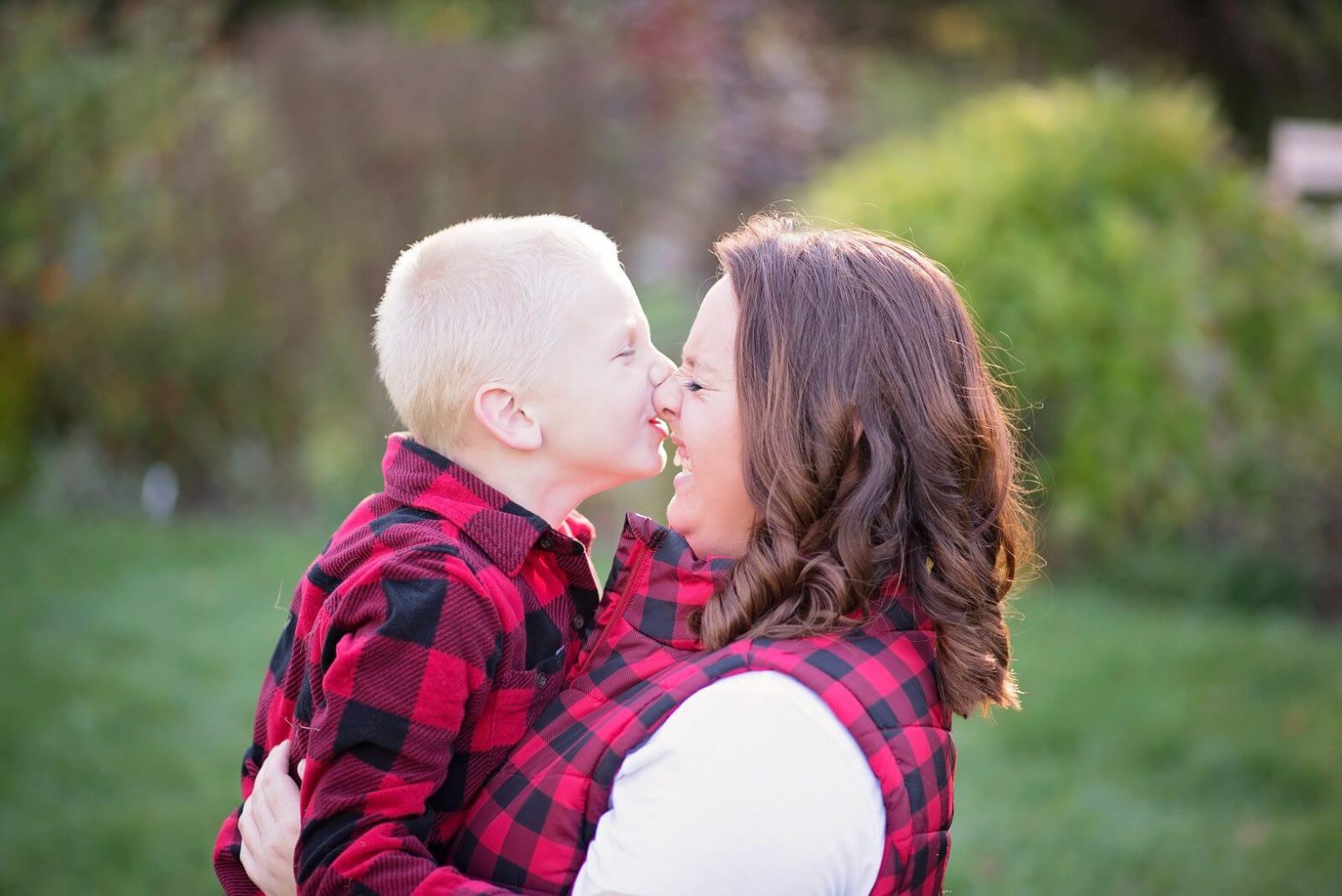 Tangie, a career adviser at Goodwill gets a kiss on the nose from her young son