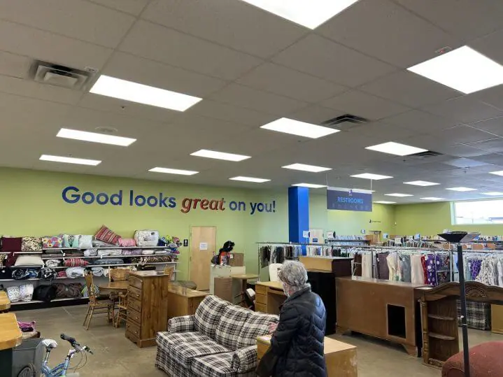 Manchester, New Hampshire Goodwill store with the words "Good looks great on you!" featured across a far green wall