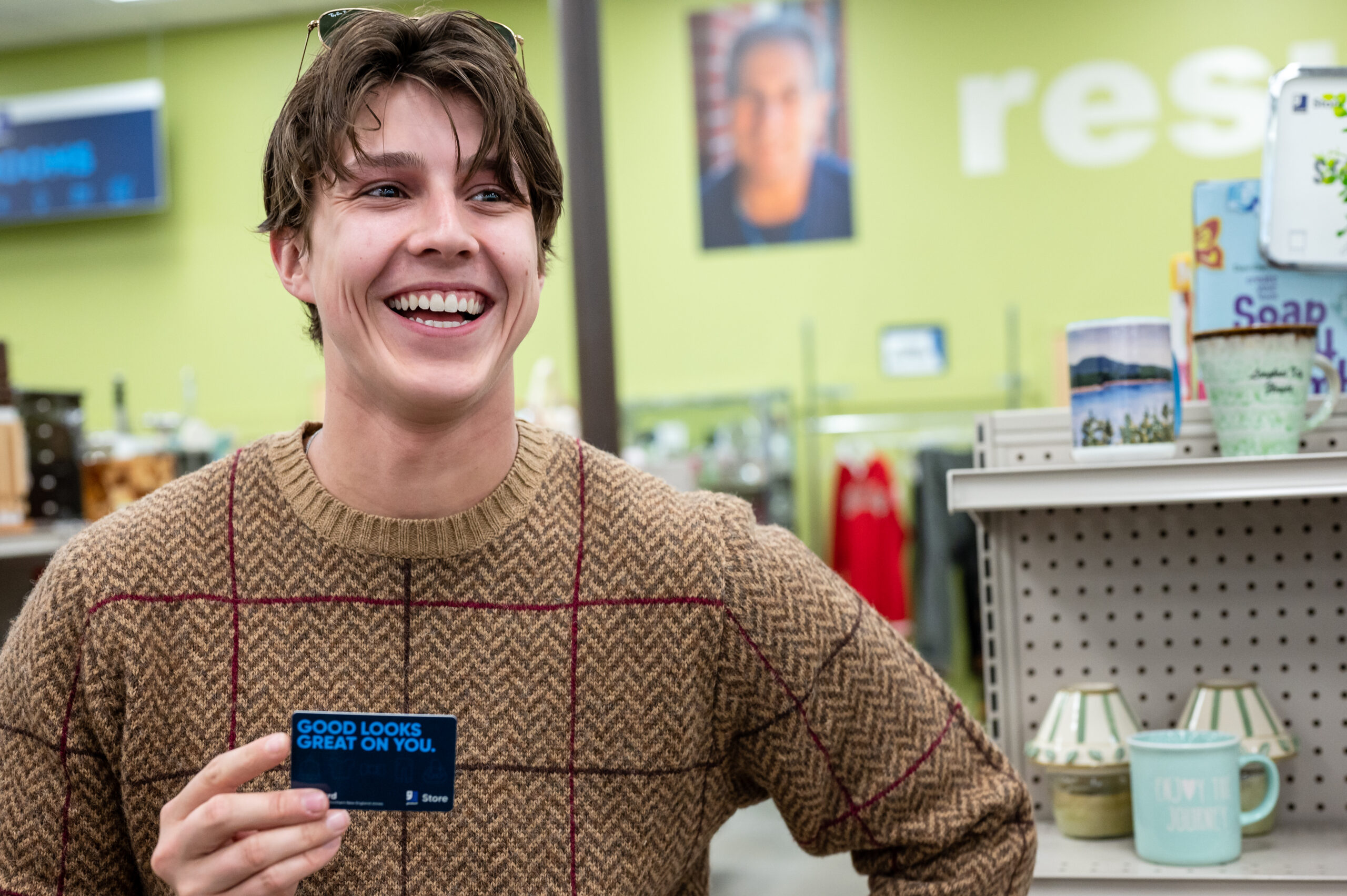 A Goodwill shopper poses with a gift card