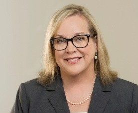 A woman smiling for a portrait 